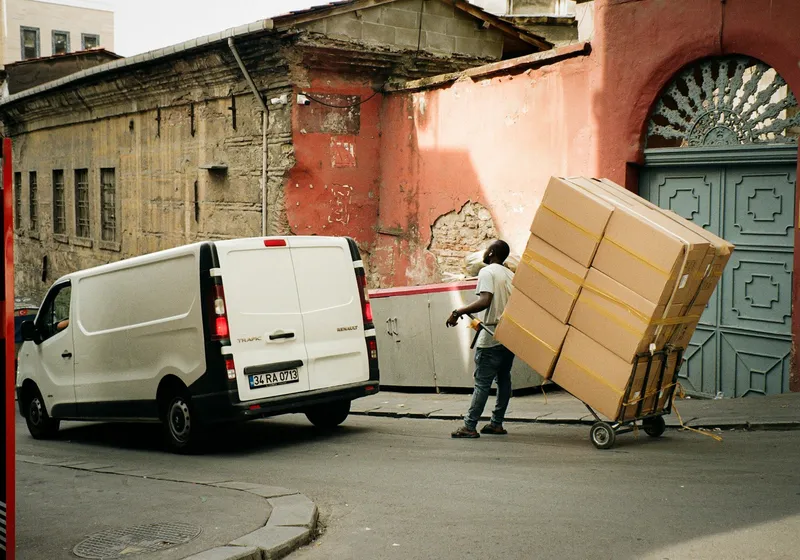 Mover wheeling boxes on a hand truck